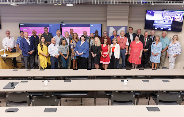 UA Little Rock faculty, staff, students, and guests participate in a classroom dedication ceremony of the newly renovated Mainstream Technologies Collaboration Studio. Photo by Ben Krain